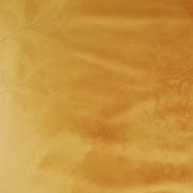 Brown wall background with a leaf